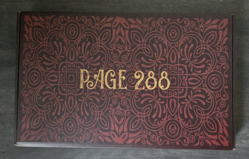 upwrapping gift #3 from once upon a book club’s romantasy box featuring The South Wind by Alexandria Warwick