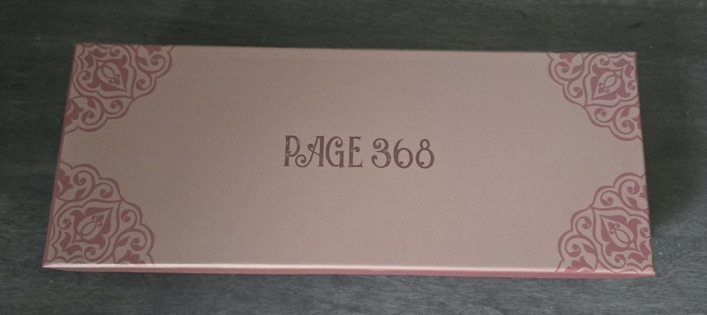 upwrapping gift #4 from once upon a book club’s romantasy box featuring The South Wind by Alexandria Warwick