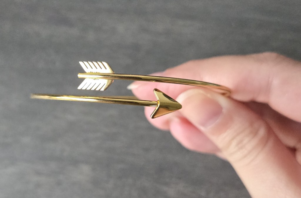 upwrapping gift #1 from once upon a book club’s romantasy box featuring The South Wind by Alexandria Warwick